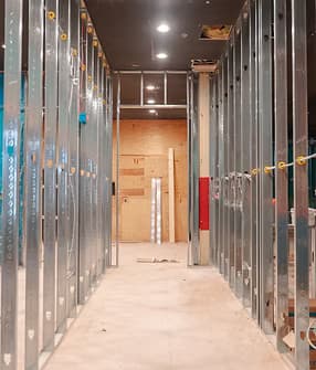 Steel stud framing during active construction — Treacy Brothers build in progress